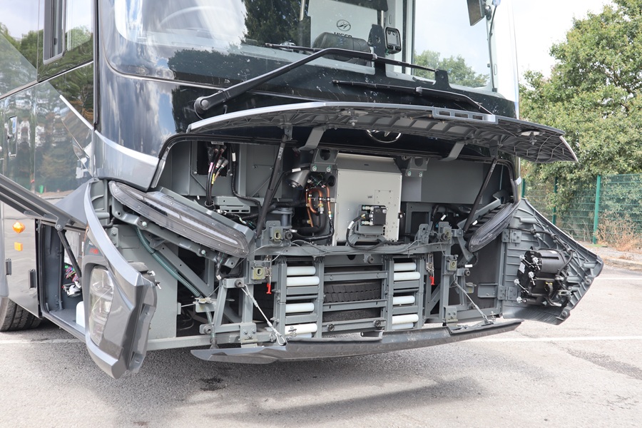 Higer V-14 coach frontal area with open inspection hatches